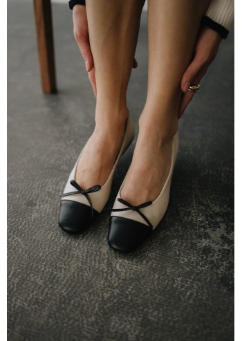 Two-tone closed-toe ballet...